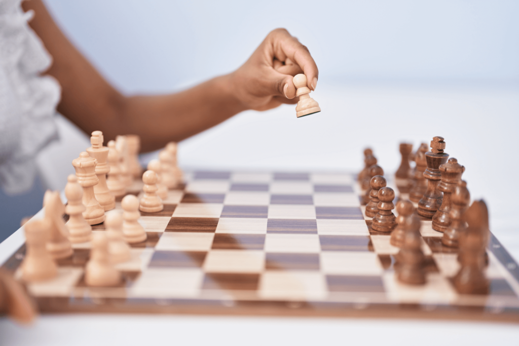 Hand playing chess